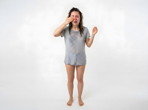 Woman reacting to soap with hand near face on plain background