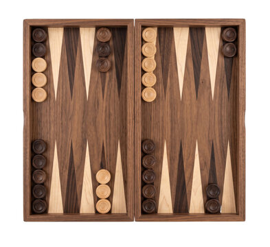 Overhead view of a wooden backgammon set with light and dark checkers on a black background