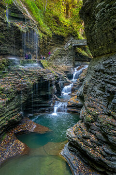 Rainbow Falls and the Mile Point stone bridge, along the Gorge Trail in Watkins Glen State Park, New York, in autumn.