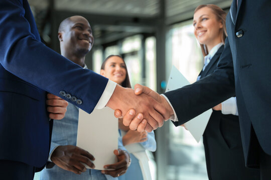 Business people shaking hands, finishing up a meeting