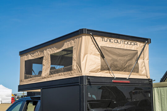 Loveland, CO, USA - August 21, 2026: Tune Outdoor camper with a pop out tent opened on a pickup truck - vehicle setup for overlanding.