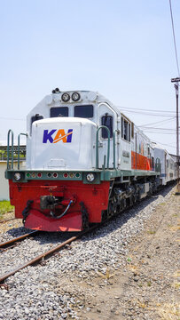 General Electric CC 201 77 16 diesel locomotive pulling Sancaka Utara train stopped at Gundih railway station in Grobogan Regency, Central Java, Indonesia.