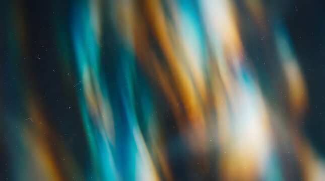 Abstract blurred motion background featuring vibrant teal, golden, and deep blue vertical streaks of light against a dark backdrop, creating a dynamic and energetic atmosphere suitable for modern