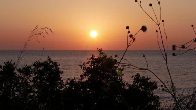 Beautiful Red Sunset on the Sea. Summer Tropical Sunset Sea View. Beautiful Seascape, Red Dusk on the Ocean.