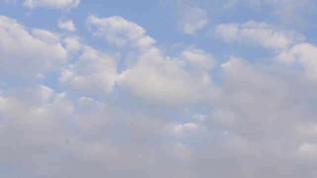 Soft Clouds Floating in a Calm Blue Sky 