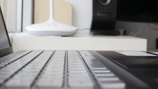 Hand Typing on Laptop Keyboard Closeup Detail