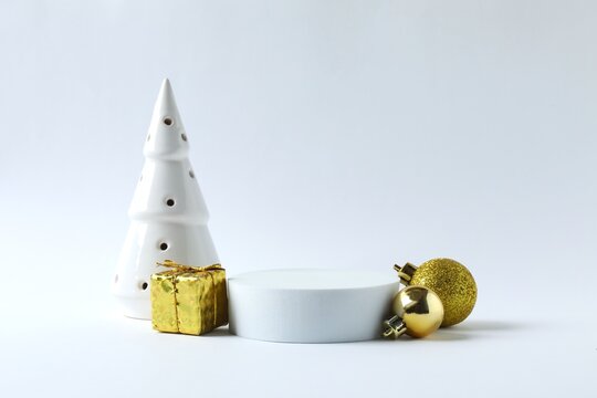 White podium with Christmas decorations on white background 