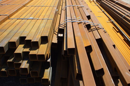 Close view of stacked square steel tubing ends in storage