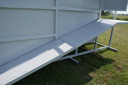 Diamond plate walkway and steel frame of a livestock loading chute