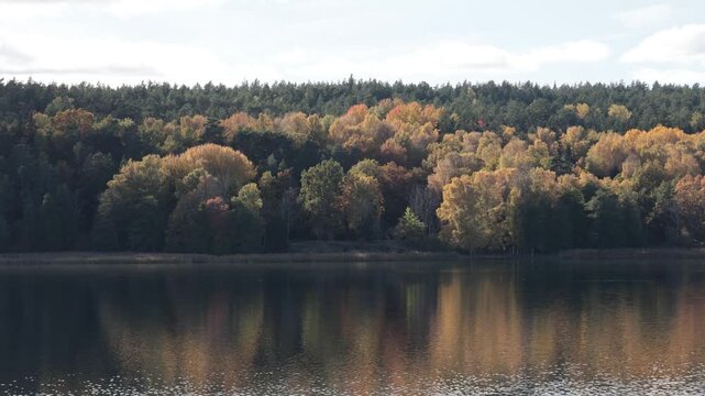 Nykoping, Sweden An autumn foliage landscape and reflections over an inlet in the Baltic Sea.  