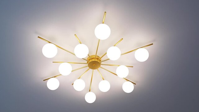 Stylish Sputnik‑style ceiling chandelier with gold rods and frosted glass globes, radiant modern lighting.
