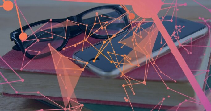 Displaying black glasses resting atop red book on desk, showing smartphone and pink network overlay
