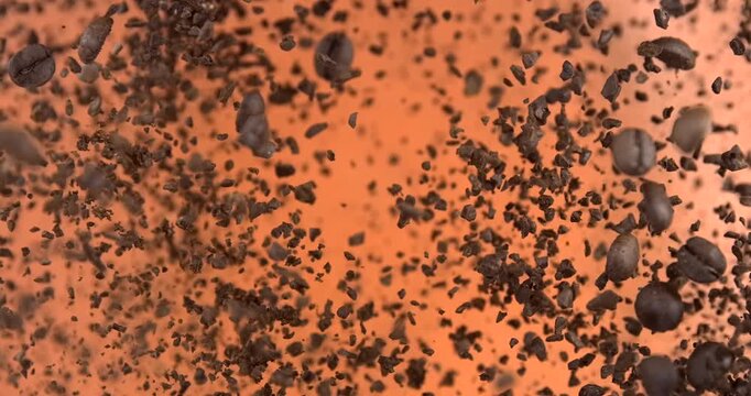 Ground coffee beans falling in slow motion 1000 fps on red background