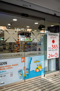 Barcelona, Spain- October 19, 2026: Modern pharmacy storefront open nonstop