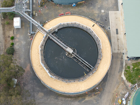 Aerial view of the Brushy Creek Wastewater Treatment Plant featuring a circular clarifier tank with a mechanical bridge in Chirnside Park, Victoria, Australia.
