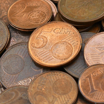 One, Two and Five euro cent coins on the table.