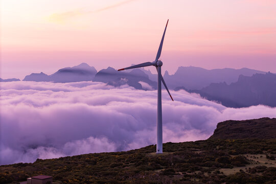 Wind turbines generating electricity in mountain in Madeira island, clean energy aerial view