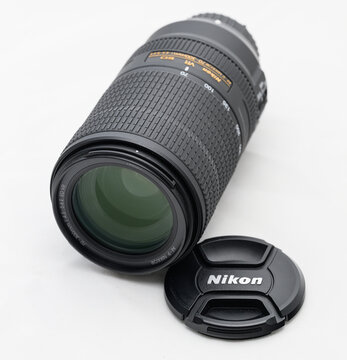 Gothenburg, Sweden - september 11 2026: Nikon 70-300mm telephoto zoom lens displayed beside front cap.