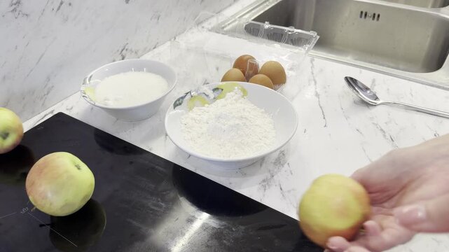 Bowls of flour and sugar sit beside brown eggs on a kitchen counter, illustrating ingredient preparation for homemade cooking and baking