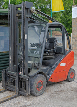 Diesel Powered Red Forklift Truck With Cabin Park Outside