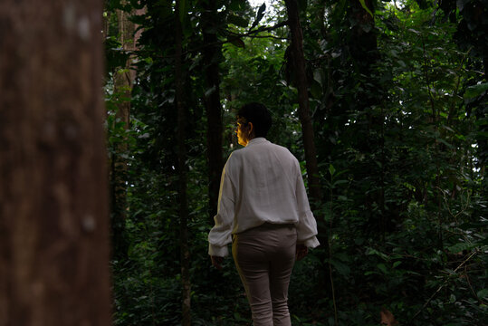 Woman walking in the forest