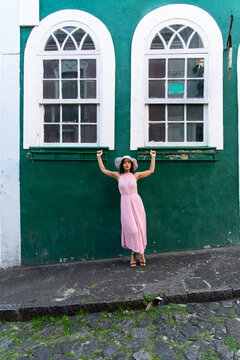 Woman in a Pink Dress and White Hat
