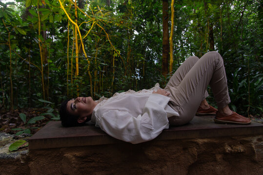 Woman resting on a stone