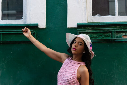 Woman in a Pink Dress and White Hat
