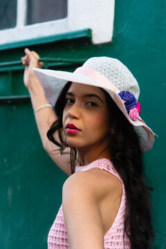 Woman in a Pink Dress and White Hat
