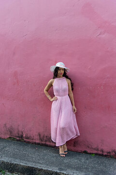 Full-Length Portrait of a Woman in a Pink Dress