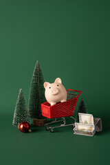 Merry Christmas shopping and savings concept with piggy bank in cart and cash for New Year on vertical side view backdrop © ActionGP