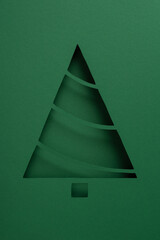 Minimal paper Christmas tree cutout with green layered design for Merry Christmas and Happy New...