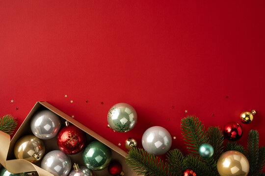 Merry Christmas ornaments and evergreen branches with ribbon and baubles for a Happy New Year celebration