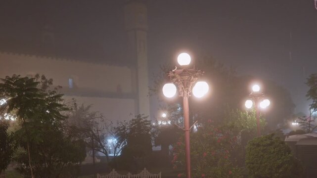Illuminated street lamps in zacatlan puebla park during foggy night