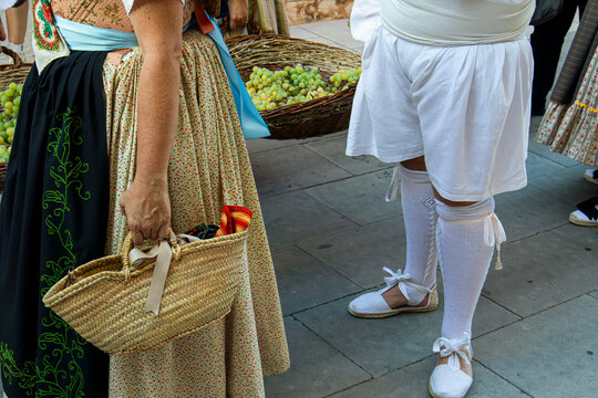 People in Traditional Folklore Costumes at Grape Stomping Festiv