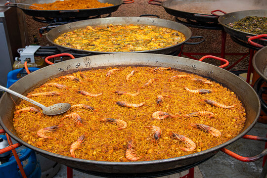 Traditional Spanish Seafood Fideua Cooked in a Giant Paella Pan