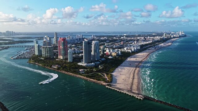 Aerial view on luxury charter yacht. Landscape aerial with Miami skyscraper. Luxury skyscraper in Miami beach. Motorboat at sea. Landscape of Miami south beach. Yacht at sea. Waterfront lifestyle
