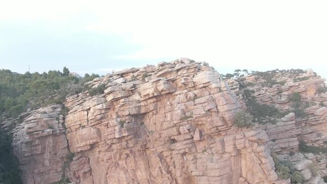 Layered Red Sandstone Rock Face on a Misty Day, Desierto de las Palmas, Spain
