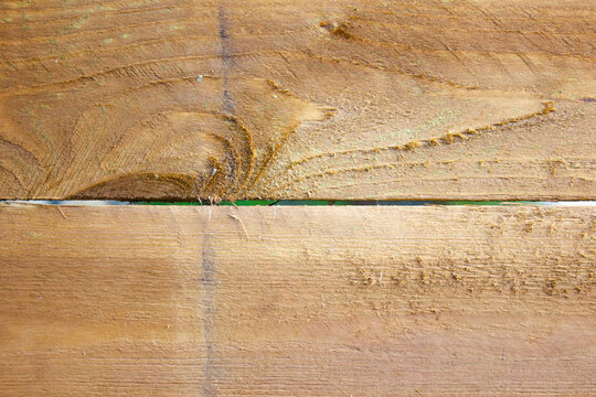 A fence made of wooden planks. Authentic wooden planks, a barrier.