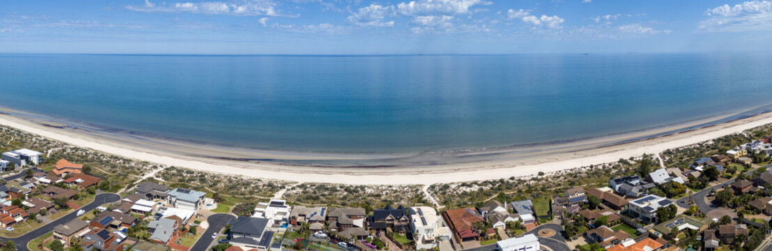 Aerial panoramic&nbsp;view of &nbsp;sandy coastline of West Lakes Shore in Adelaide, South Australia, coastal dunes separating luxury beachfront homes from the blue waters of Gulf St Vincent.