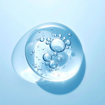 A clear cosmetic gel drop with sparkling air bubbles, radiating purity and hydration. Macro shot on blue, no people. Perfect for luxury skincare, dermatological, and wellness concept imagery.