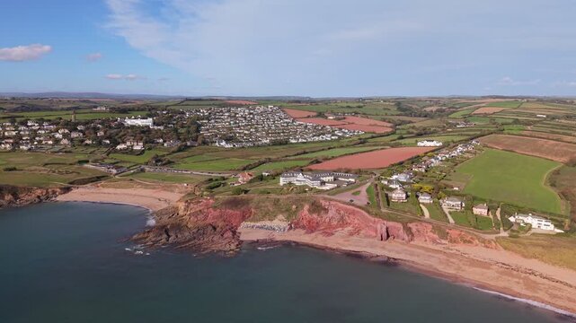 Aerial drone footage of South Milton Sands in South Devon, showcasing the sandy beach, turquoise coastal waters, rugged shoreline and scenic landscape of the English coast
