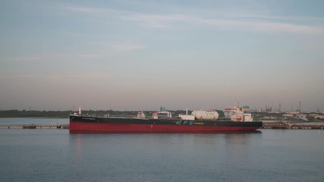 Sunrise over Gas Ships and Esso Oil Terminal, Southampton, Hampshire, England, United Kingdom