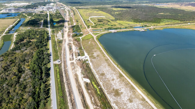 Aerial view of the Phosphor 4 Corners Mine featuring large water reservoirs and industrial infrastructure surrounded by rural landscape in Duette, Florida, United States.