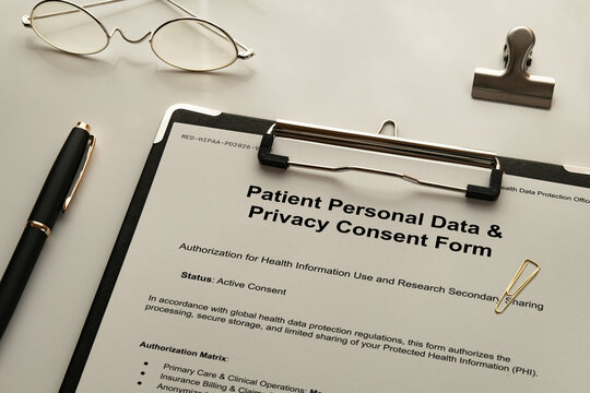 Patient Personal Data  and  Privacy Consent Form Staged on Desk &mdash; ideal eye-catcher for healthcare data protection and HIPAA compliance articles