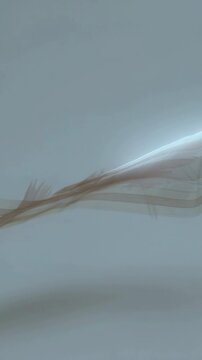 Vertical video: Appearing left sheer ribbon moving right waving across gray field