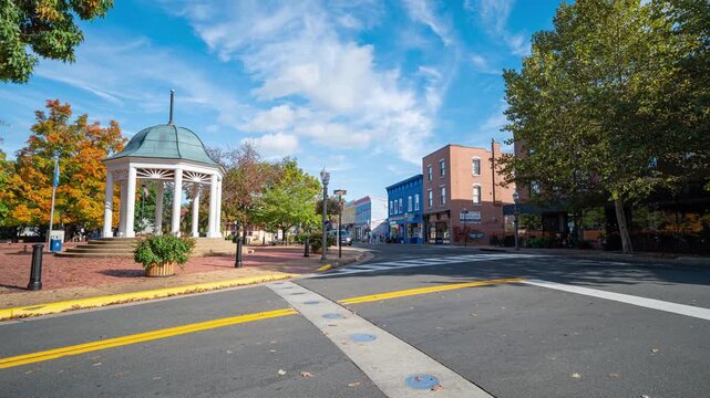 Front Royal, Virginia, gazebo and town square in historic downtown with traffic moving through the intersection timelapse.