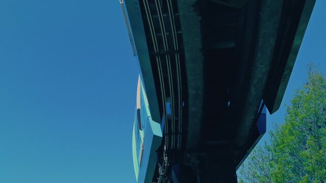 Monorail Train Passing Overhead In The Daytime
