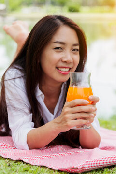 Vertical Picnic basket food bread fresh fruit coffee cup orange juice wood wicker box. Vertical Wheat bakery fruit food drinks green park outdoor lifestyle. Healthy appetizer box outdoors garden