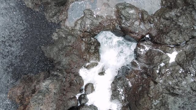 A close overhead take returns to the rock basin near Punta Brava with a rougher faster surge than earlier passes. The shortest of these Tenerife texture studies.